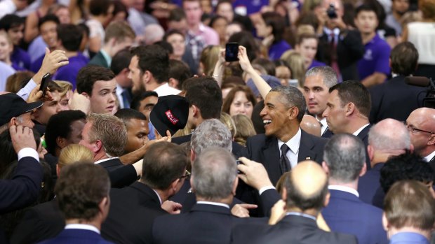 US President Barack Obama greets audience members after his speech at the University of Queensland.