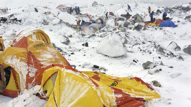 Climbers search through crushed tents in the aftermath of the avalanche at Everest base camp.