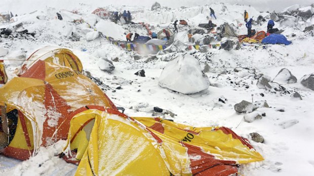 Climbers search through crushed tents in the aftermath of the avalanche at Everest base camp.