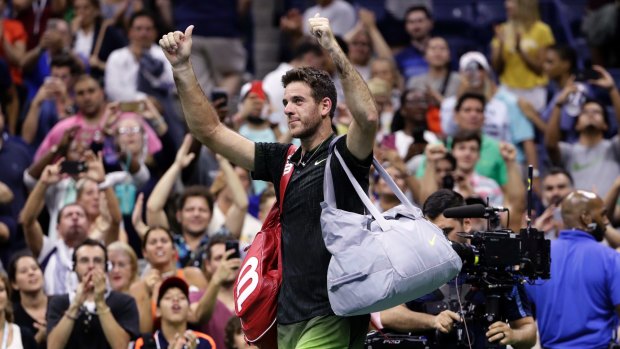 Juan Martin del Potro acknowledges the cheering crowd as he leaves the court.