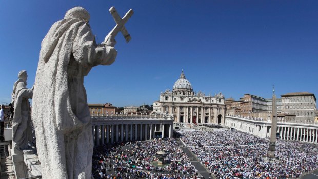 St Peter's Square is crowded with the faithful and with tourists. 