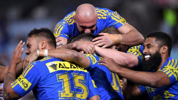 Back to winning ways: Parramatta Eels players celebrate one of their five tries on Thursday.