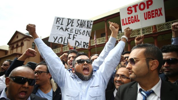Taxi drivers vent their anger over the ride-sharing service Uber at a protest outside the NSW State Parliament.