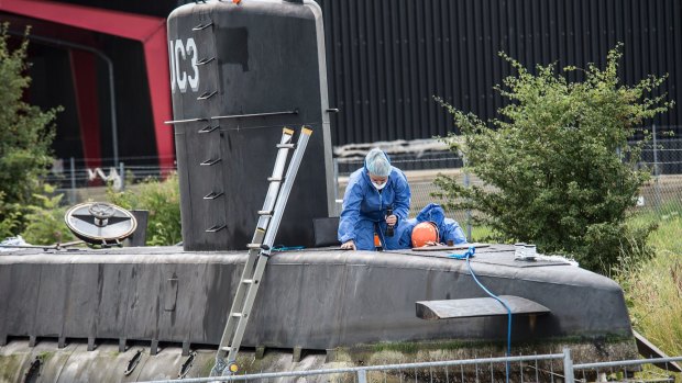 Police technicians on board the home-made submarine UC3 Nautilus.