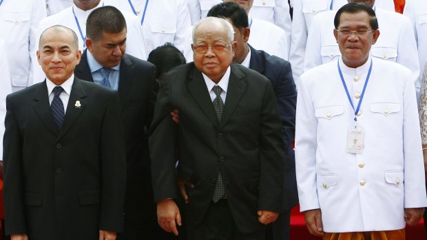 Cambodia's King Norodom Sihamoni, left, with Senate President Chea Sim, centre, and Prime Minister Hun Sen, in 2013.