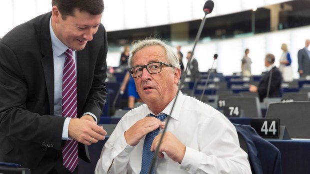 'Not enough union': Jean-Claude Juncker adjusts his tie as he prepares to deliver his  address.
