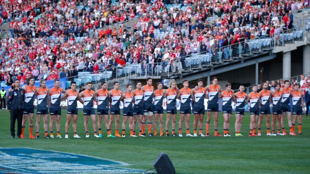 The Giants line up for the national anthem during the 2016 AFL First Qualifying Final match against the Sydney Swans at ANZ Stadium.