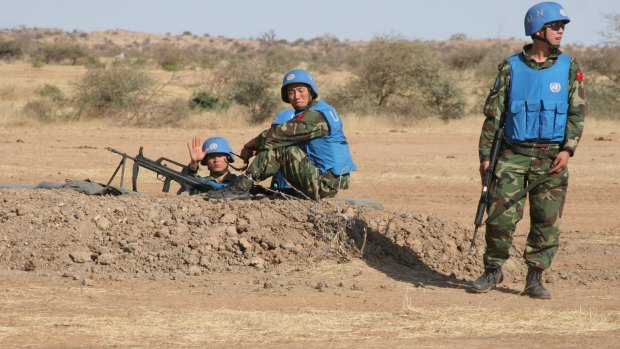 Chinese U.N. peacekeepers in Sudan. Amnesty International's report says peacekeepers have been prevented by Sudan's government from protecting civilians.