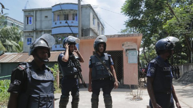 Bangladesh policemen cordon off the area near a two-story house that they raided in Narayanganj district near Dhaka, Bangladesh, on Saturday August 27, 2016.