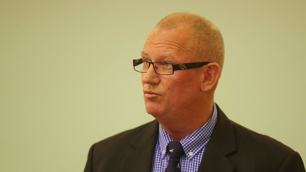 Corrections minister Bill Byrne MP has denied a restraint used on a prisoner was a spit mask.