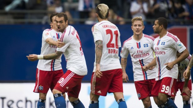 Hamburg's Pierre-Michel Lasogga (second left) celebrates a goal.