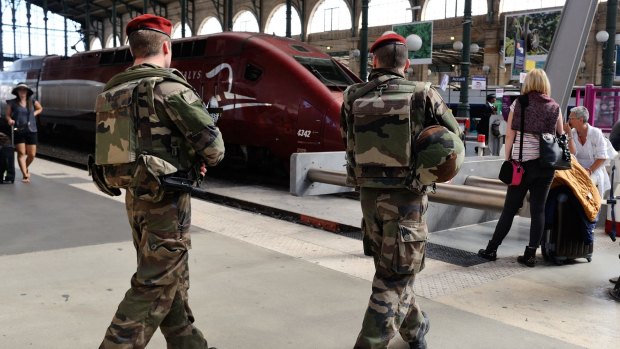 French soldiers patrol the Gare du Nord station in Paris on Saturday.