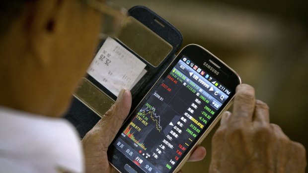 Checking stock prices via a smartphone. 