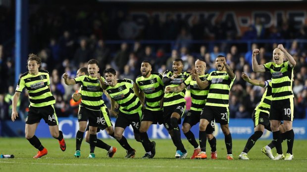 Huddersfield Town's players celebrate their victory.