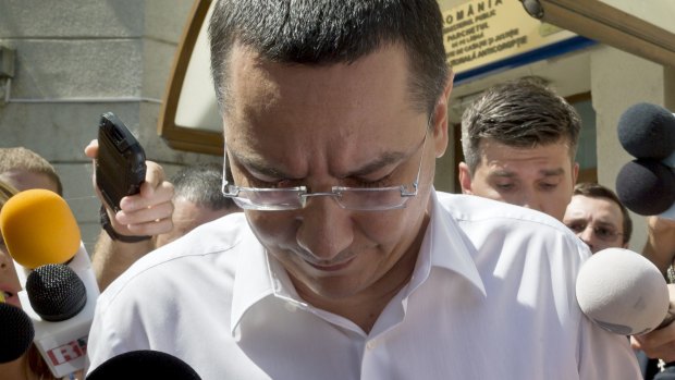 Romanian prime minister Victor Ponta exits the national anti-corruption prosecutors office last year.