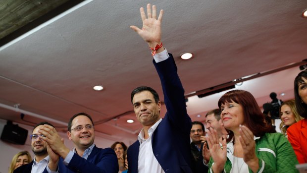Pedro Sanchez, leader of the Socialist Party, waves to supporters on Sunday night.