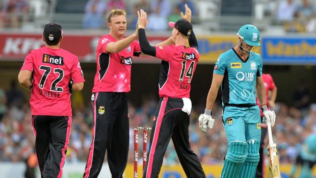 Good night's work: Doug Bollinger of the Sixers celebrates after taking the wicket of Chris Lynn.
