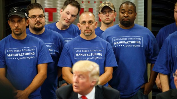 Workers at Staub Manufacturing listen as Donald Trump speaks on the campaign trail in Ohio in September. 