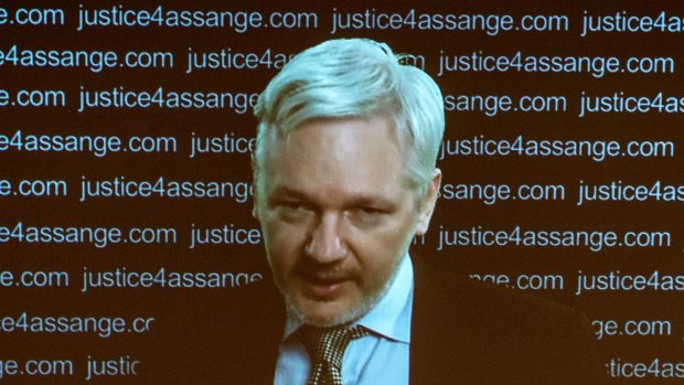 Julian Assange speaks via video link from the Ecuadorian Embassy in London.