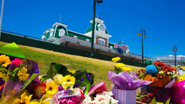 A memorial to the four victims has grown outside Dreamworld.