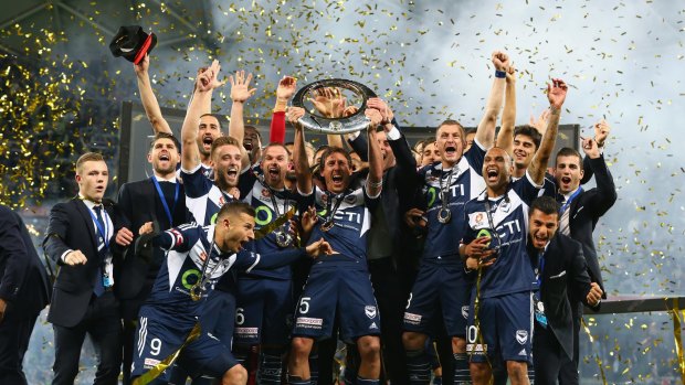 2014/15 champions: The Victory celebrate their grand final win.