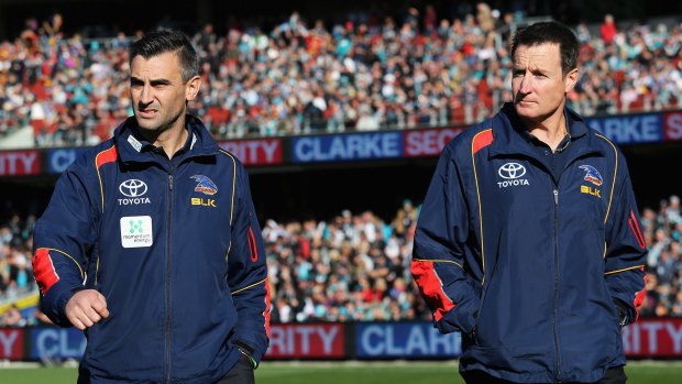 Winning team: Matthew Lloyd says the Crows should retain the coaching structure of Scott Camporeale (left) and John Worsfold.