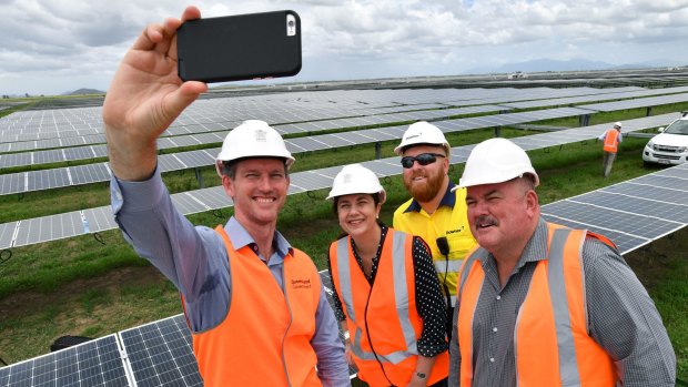 Energy Minister Mark Bailey, left, takes a selfie with Queensland Premier Annastacia Palaszczuk at the Clare Solar Farm in North Queensland.