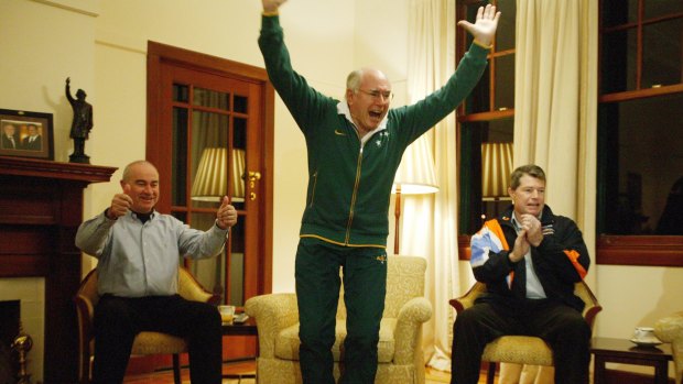 John Howard cheers on the Socceroos in the 2006 World Cup. His guests at The Lodge were parliamentary colleagues Gary Nairn, left, and David Fawcett.