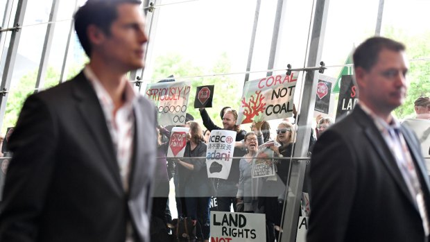 People protest against the Carmichael coal mine outside the International Mining and Resources Conference in Melbourne on Wednesday.