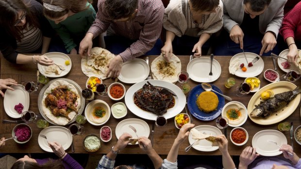 A feast at Zahav begins with fresh, hot pita and hummus.