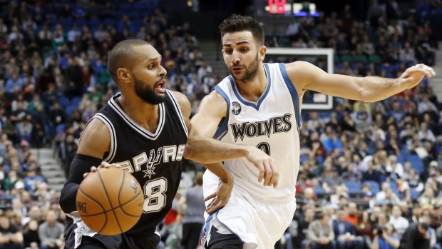 On the ball: Patty Mills was promoted to the Spurs' starting line-up. 