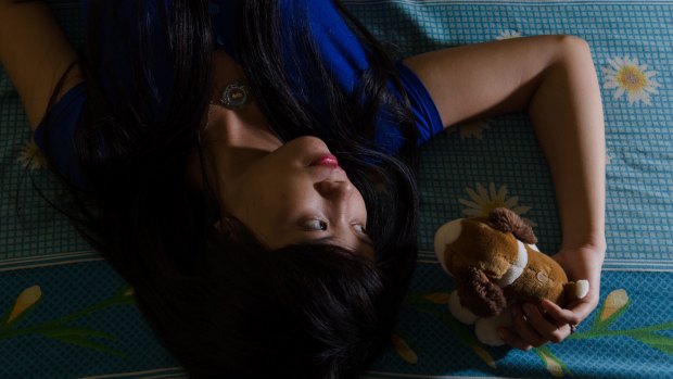 "Cash cows": Nur'Asiah, a sex worker in her room in Indramayu, West Java.