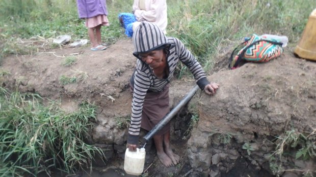 Water shortages force PNG villagers to walk long distances in the Eastern Highlands to collect drinking water.