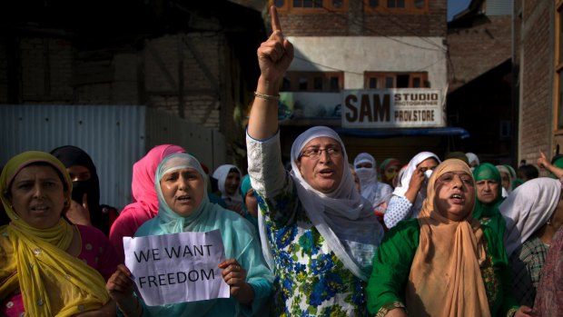Kashmiri Muslim women shout freedom slogans during a protest after Eid al-Adha prayers in Srinagar, Indian-controlled Kashmir on September 13.