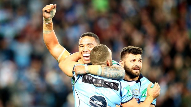 At last: The Blues celebrate winning game three of the State Of Origin series.