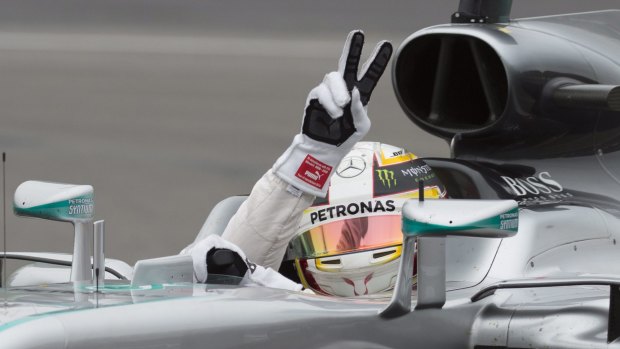 Thrilled: Mercedes driver Lewis Hamilton gestures to the fans after winning the pole position in the qualifying session at the F1 Canadian Grand Prix.