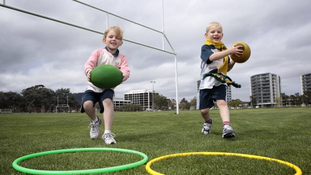 Isobel Marlow 6 of Franklin and Oscar Marlow 4 at Rugbytots at Southwell Park in Lyneham. 