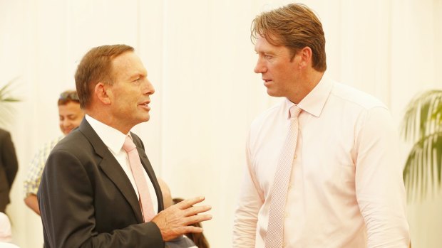 Busy man: Tony Abbott talks to Glenn McGrath on Jane McGrath day at the SCG.