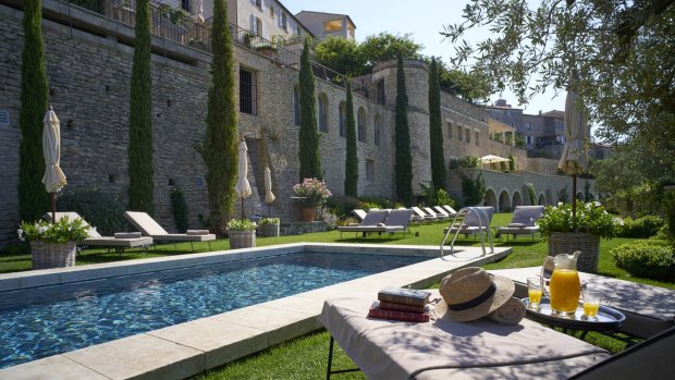 Swimming pool and garden terraces at La Bastide de Gordes. 