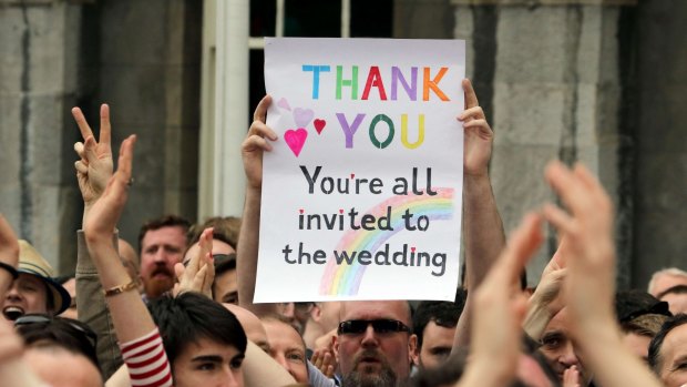 A supporter holds a sign during celebrations of the vote to legalise same-sex marriage in Ireland.