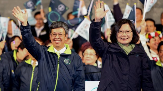 Tsai Ing-wen, Taiwan's president-elect, right, and Chen Chien-jen, vice-president-elect, left, wave to supporters after delivering a victory speech in Taipei, Taiwan, on January 16.