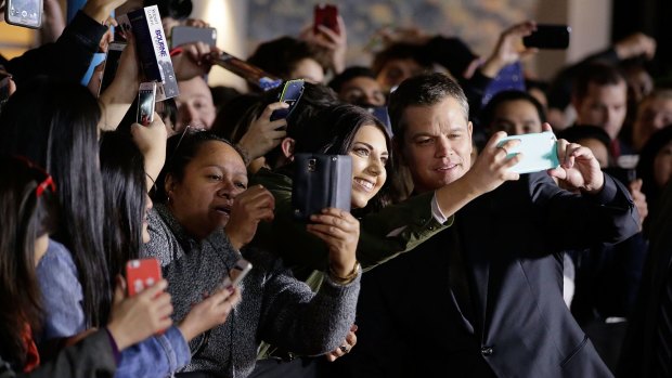 Matt Damon poses for selfies at the premier of <i>Jason Bourne</i> in Sydney.