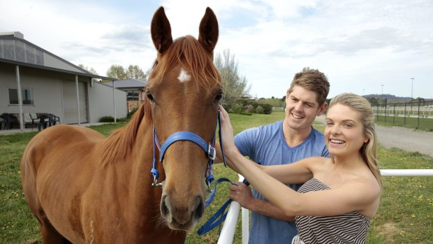 Erin Molan and her partner, the NSW cricker player Daniel Hughes, with their filly.  