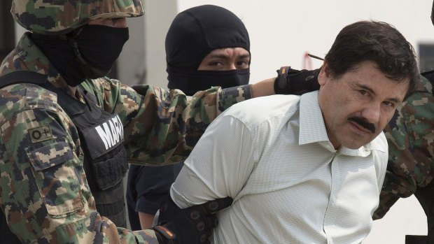 Mexican drug trafficker Joaquin "El Chapo" Guzman is escorted by security forces after his capture. Mexican drug cartels are beginning to move into Australia.