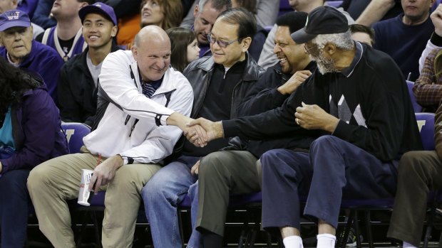 Steve Ballmer, left, pressing the flesh with former NBA players earlier this year.