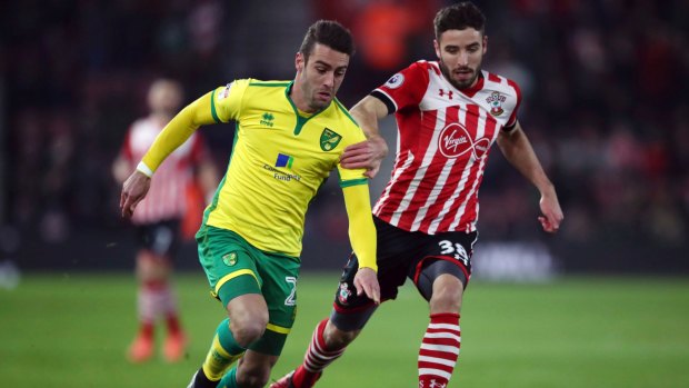 Norwich City's Ivo Pinto, left, and Southampton's Sam McQueen go one-on-one.
