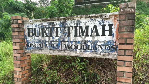 Painted letters peel from a sign. Bukit Timah Railway Station was once an intermediate stop.