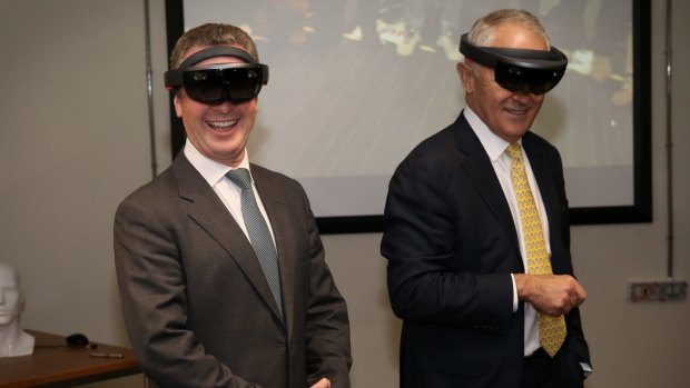 Then innovation minister Christopher Pyne and Prime Minister Malcolm Turnbull don mixed reality goggles at Saab in Adelaide on the election campaign trail in June.