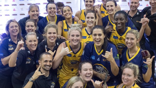 Grinners: The winning Sydney team with the 2017 WNBL grand final trophy. 