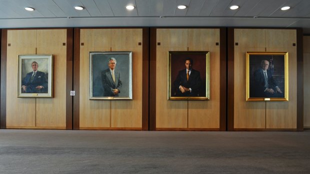 Portrait paintings hanging on the walls of the first floor art space in Parliament House.